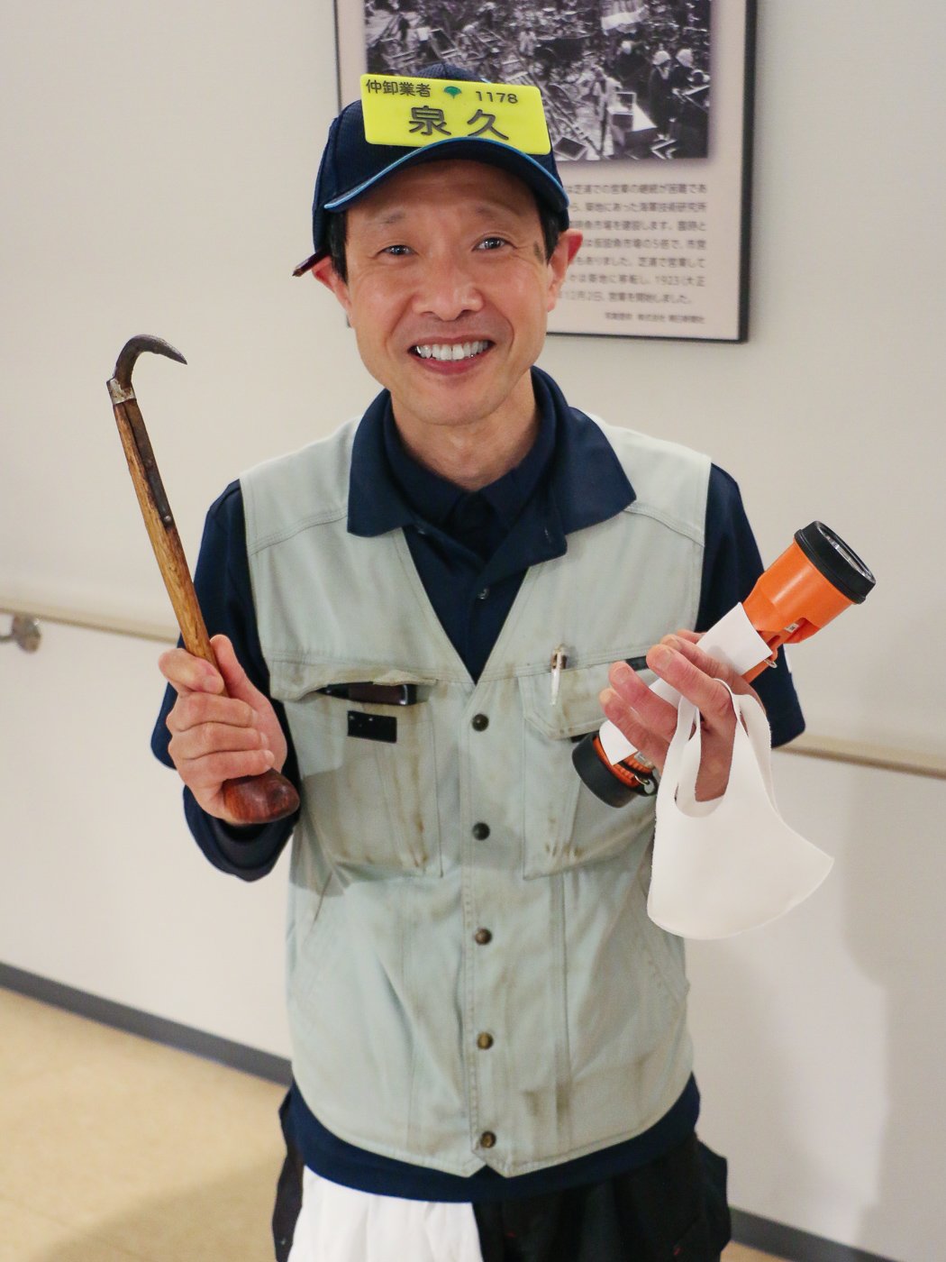 Toyosu tuna auction wholesale buyer with his hook and torch