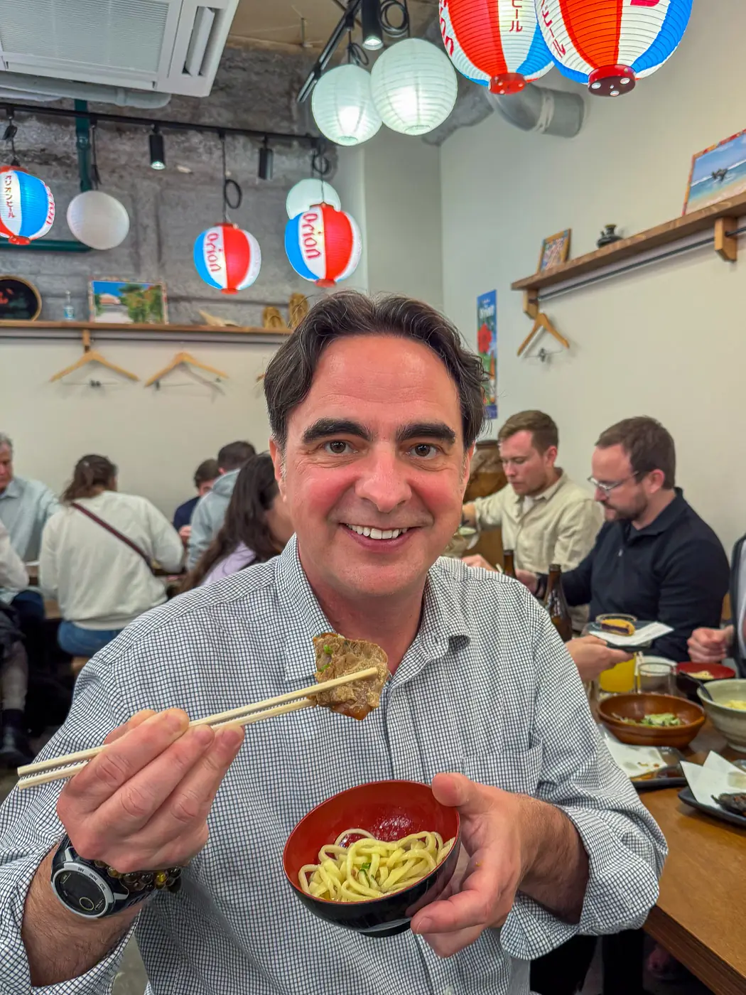 Chris P King from Food Tours Japan eating agu pork soba noodles