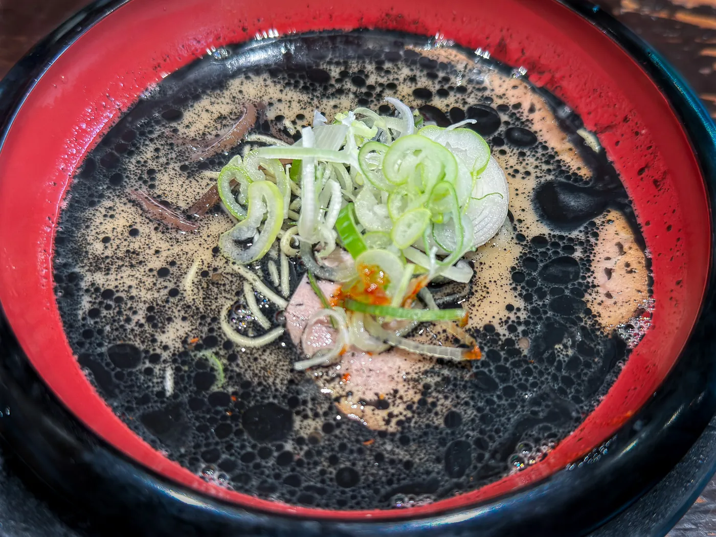 Black King tonkotsu ramen with squid ink and charred garlic oil