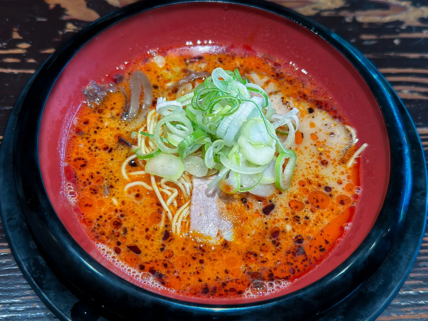Spicy Red King tonkotsu ramen topped with spring onion