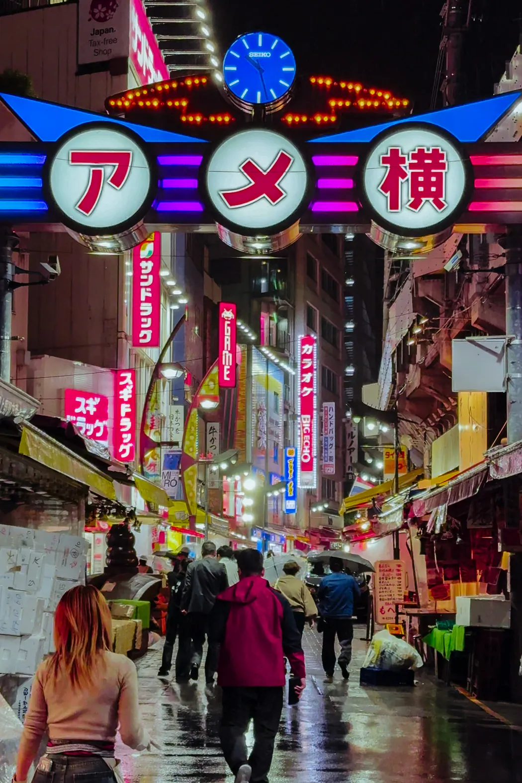 Neon-lit Ameyoko market street in Ueno, Tokyo