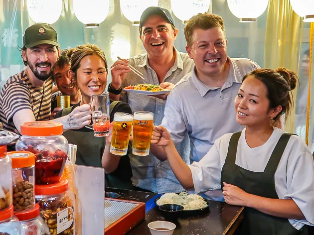 Me enjoying an Osaka food tour in Shinsekai