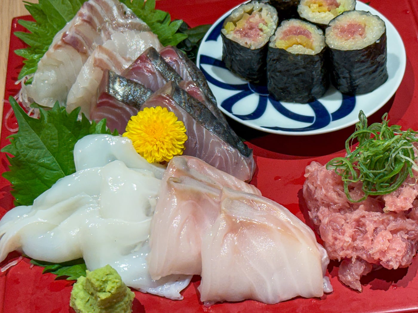 Assorted sashimi and sushi served at the first izakaya on my Shinjuku food tour in Tokyo