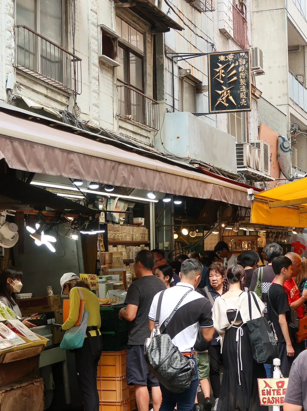 Stalls and visitors at Tsukiji Outer Market in Tokyo